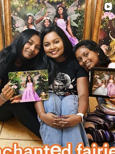Sisters showing off their portraits